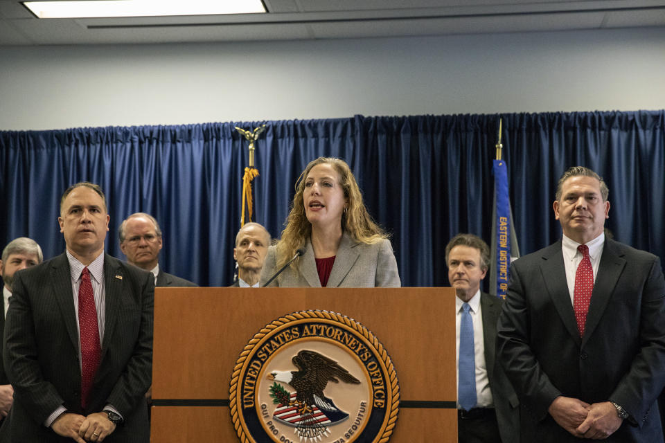 Jennifer Arbittier Williams, center, assistant United States Attorney with the Criminal Division of the U.S. Attorney's Office in Philadelphia, speaks next to Michael Harpster, right, FBI special agent of the Philadelphia Division, and Guy Ficco, left, of the IRS, regarding the indictment of Local 98 leader John "Johnny Doc" Dougherty at the U.S. Attorney's office in Center City Philadelphia on Wednesday, Jan. 30, 2019. Dougherty, a powerful union boss who has long held a tight grip on construction jobs in the Philadelphia region and wielded political power in the city and Statehouse, was indicted on embezzlement and fraud charges along with a city councilman and six others. (Heather Khalifa/The Philadelphia Inquirer via AP)