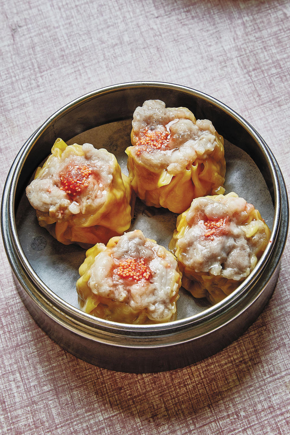This image released by Ecco shows a dumpling recipe siu mai, featured in “The Nom Wah Cookbook: Recipes and Stories from 100 Years at New York City's Iconic Dim Sum Restaurant," by Wilson Tang. (Alex Lau/Ecco via AP)