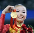 <p>He Kexin, a Chinese gymnast, won two gold medals during the 2008 Olympics...all the while dealing with speculation that she wasn't allowed to compete. Though her passport stated she was 16 years old at the time of the Olympics, several other registration systems featured a 1994 birthday for her, making her 14 during the Olympics and ineligible. Speaking to reporters after the 2008 Olympic team final, Kexin said, "My real age is 16. I don't care what other people say," and the IOC agreed to leave it at that.</p>