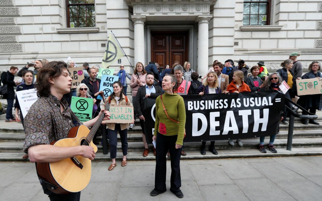 Climate protesters have targeted HM Treasury in Westminster  - REUTERS