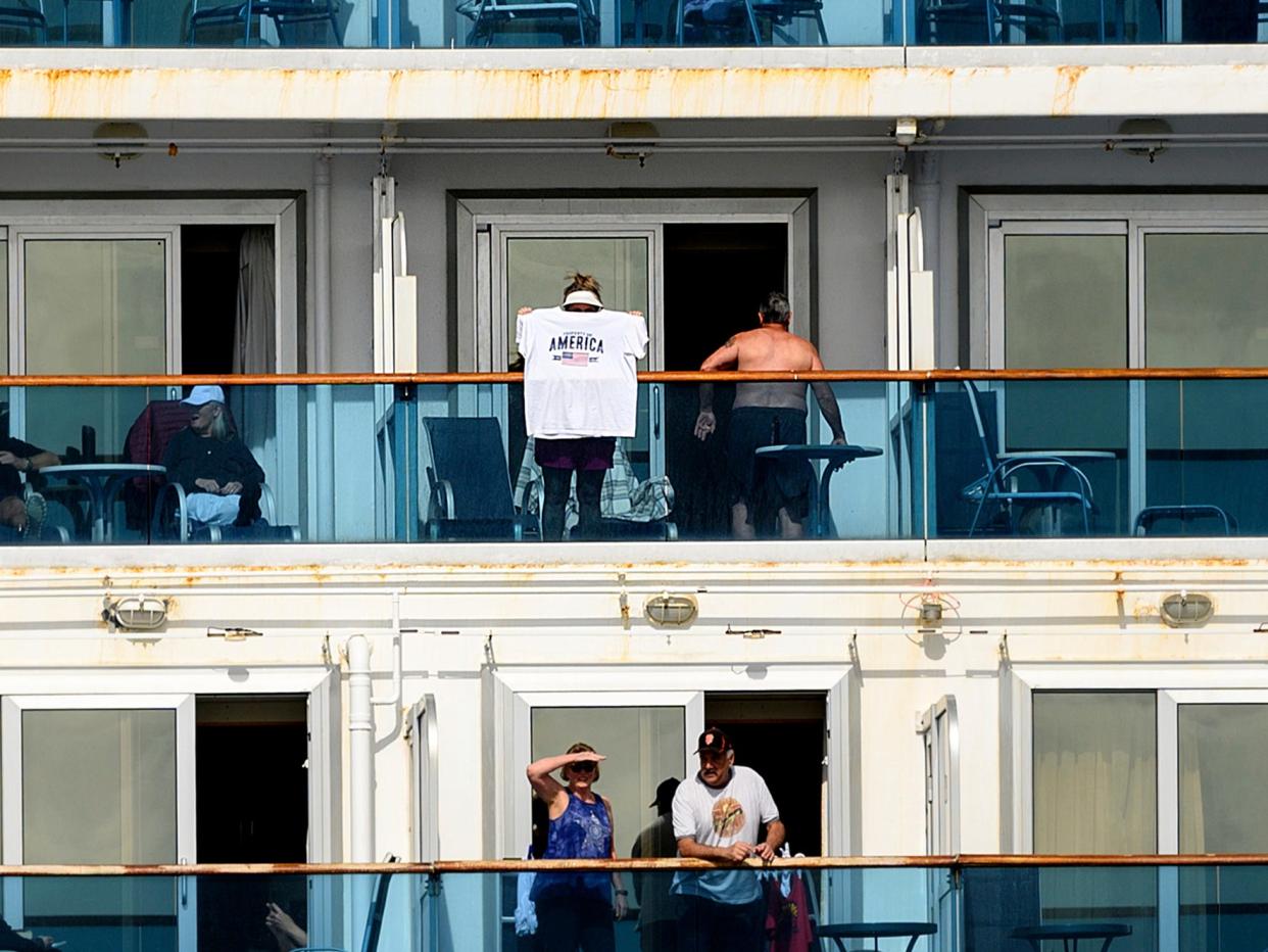 8 Passengers look out from balconies aboard the Grand Princess as it cruises a holding pattern about 25 miles off the coast of San Francisco on Sunday, March 8, 2020.