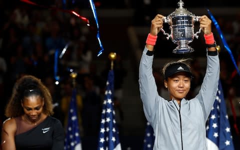 Naomi Osaka of Japan poses with the championship trophy after winning the Women's Singles finals match against Serena Williams of the United States on Day Thirteen of the 2018 US Open at the USTA Billie Jean King National Tennis Center on September 8, 2018 in the Flushing neighborhood of the Queens borough of New York City. - Credit: &nbsp;Getty Images&nbsp;