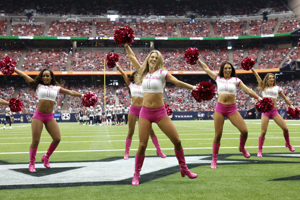 FILE - Houston Texans cheerleaders perform during an NFL football game against the New England Patriots, Sunday, Oct. 10, 2021, in Houston. Coaches Ron Rivera and Sean McDermott, standout players Christian McCaffrey, George Kittle and Demario Davis, team owner Arthur Blank, and the Houston Texans cheerleaders are among nominees from 31 teams for the NFL's Salute to Service Award. (AP Photo/Matt Patterson, File)