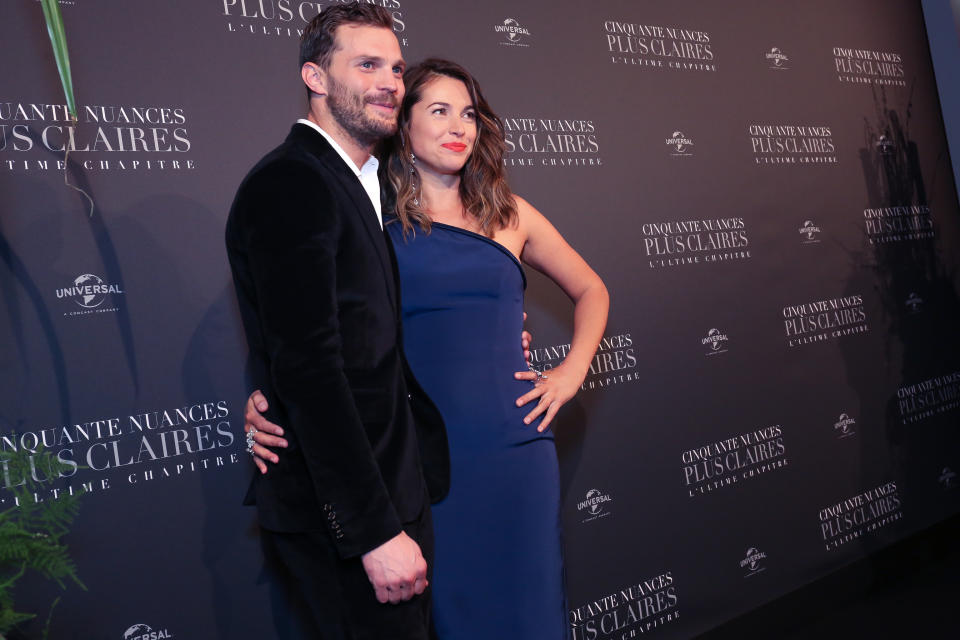 <p>Rita Ora, Jamie Dornan, and Dakota Johnson photographed for the Fifty Shade Freed Premiere on Feb 6, 2018 in Paris, France. (Photo by Olivier VIGERIE / Contour by Getty Images) </p>