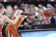 Texas' Courtney Ramey (3) passes the ball during the first half of an NCAA college basketball game against Texas Tech in Lubbock, Texas, Saturday, Feb. 27, 2021. (AP Photo/Justin Rex)