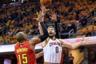 May 4, 2016; Cleveland, OH, USA; Cleveland Cavaliers forward Kevin Love (0) shoots over Atlanta Hawks center Al Horford (15) during the first quarter in game two of the second round of the NBA Playoffs at Quicken Loans Arena. Mandatory Credit: Ken Blaze-USA TODAY Sports.