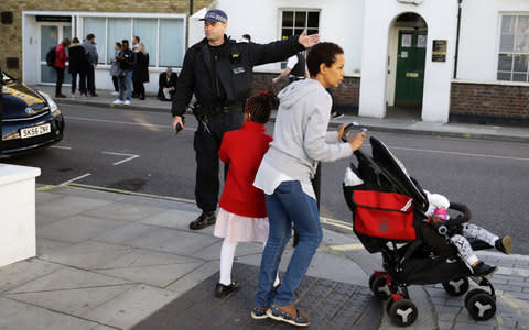  A police officer stands outside Parsons Green tube station in London - Credit: KEVIN COOMBS/Reuters