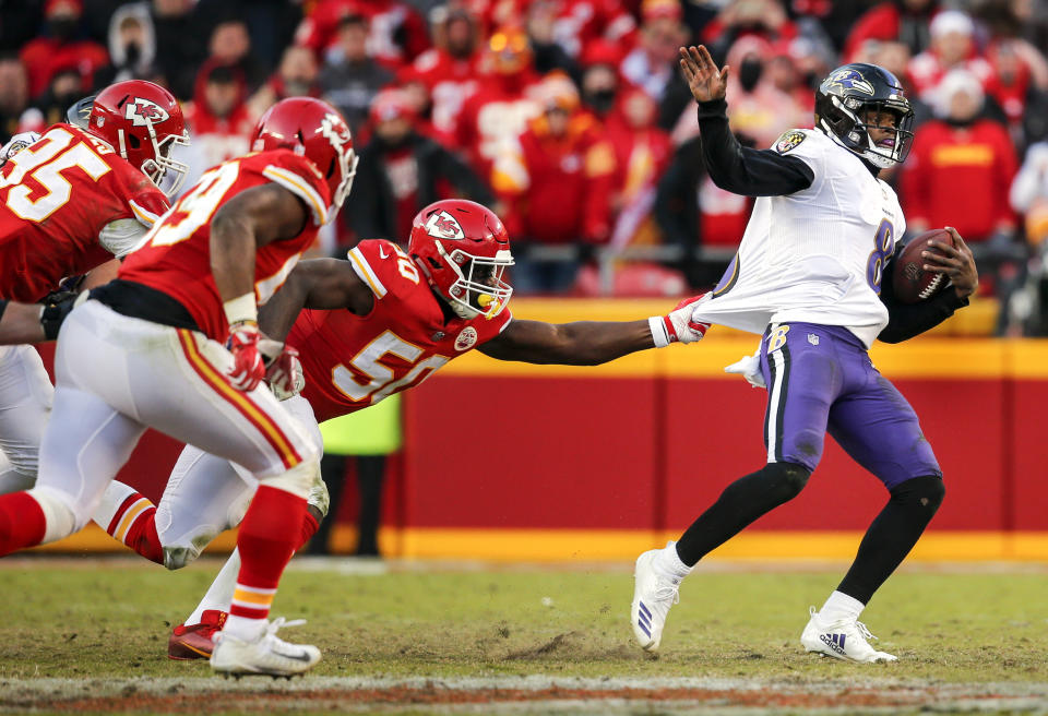 <p>Justin Houston #50 of the Kansas City Chiefs pulled the jersey of quarterback Lamar Jackson #8 of the Baltimore Ravens in overtime at Arrowhead Stadium on December 9, 2018 in Kansas City, Missouri. The Chiefs beat the Ravens, 27-24. (Photo by David Eulitt/Getty Images) </p>