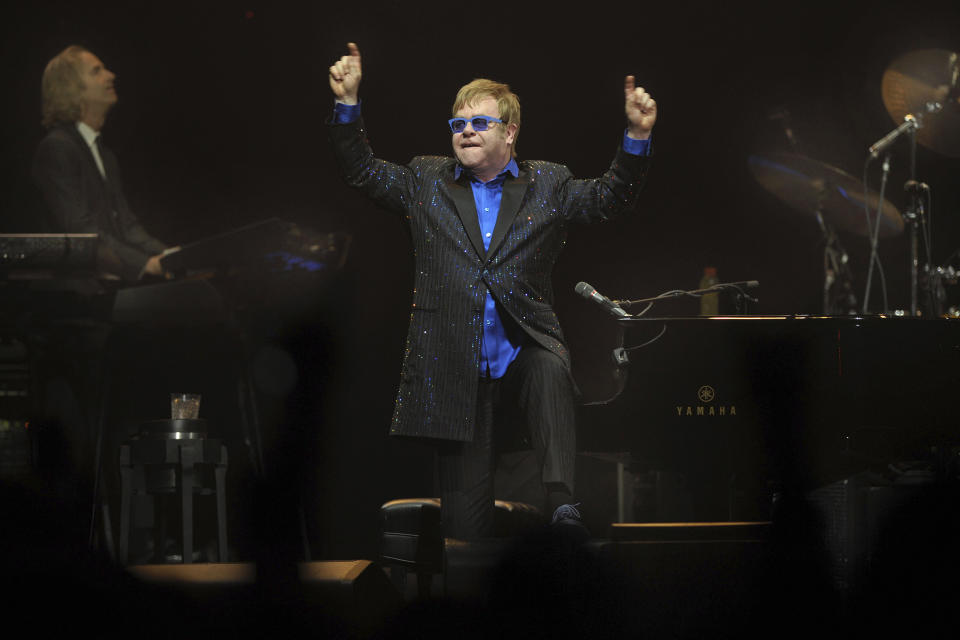 In this photo taken Sunday Nov. 25, 2012, pop icon Elton John performs during his concert in Beijing. John publicly dedicated his only concert in Beijing to Chinese artist and political critic Ai Weiwei, sending a murmur of shock through audience members accustomed to tight censorship of entertainment. (AP Photo) CHINA OUT