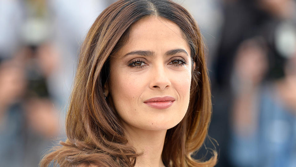 Salma Hayek poses on red carpet