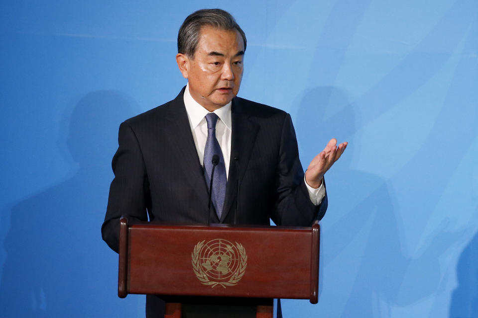 China's Foreign Minister Wang Yi addresses the Climate Action Summit in the United Nations General Assembly, at U.N. headquarters, Monday, Sept. 23, 2019. (AP Photo/Jason DeCrow)