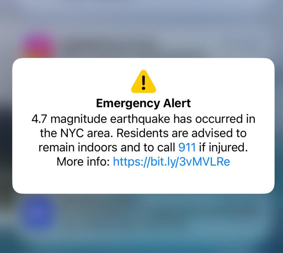 A screenshot of an emergency alert notification from a mobile phone regarding a 4.7-magnitude earthquake felt in New York City on April 5, 2024.