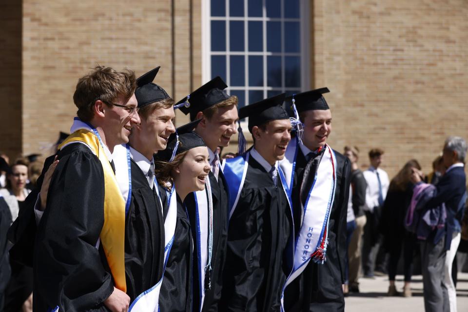 Graduates of the Class of 2022 at Hillsdale College celebrate Saturday.
