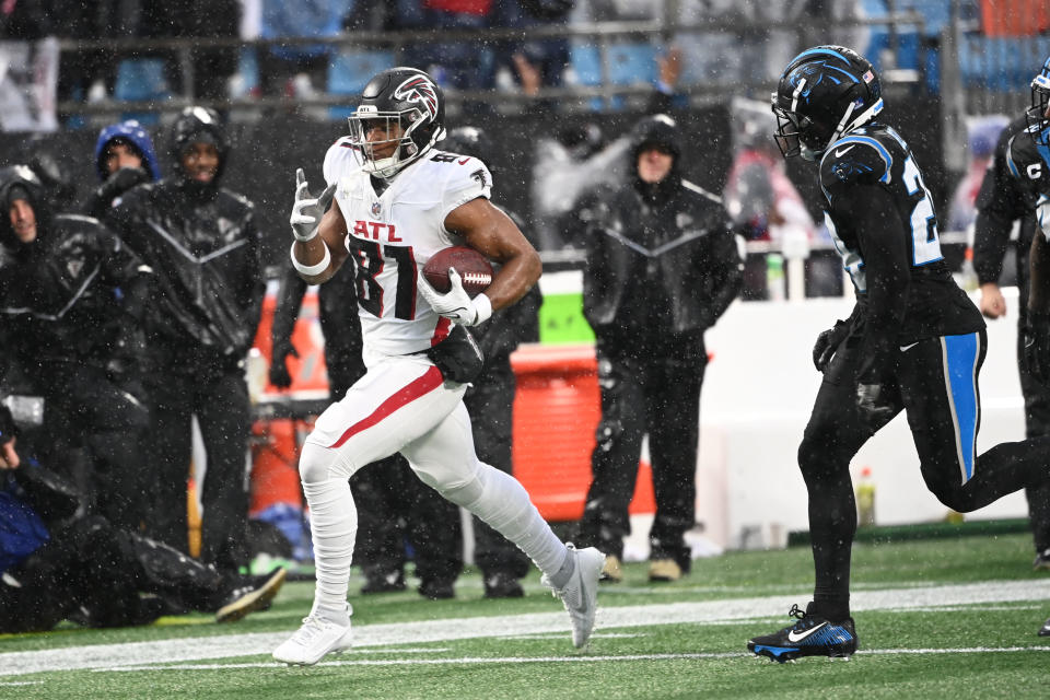 Dec 17, 2023; Charlotte, North Carolina, USA; Atlanta Falcons tight end Jonnu Smith (81) with the ball as Carolina Panthers safety Vonn Bell (24) defends in the second quarter at Bank of America Stadium. Mandatory Credit: Bob Donnan-USA TODAY Sports