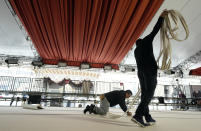 Crew members ready the white carpet for Sunday's 95th Academy Awards, Wednesday, March 8, 2023, outside the Dolby Theatre in Los Angeles. (AP Photo/Chris Pizzello)