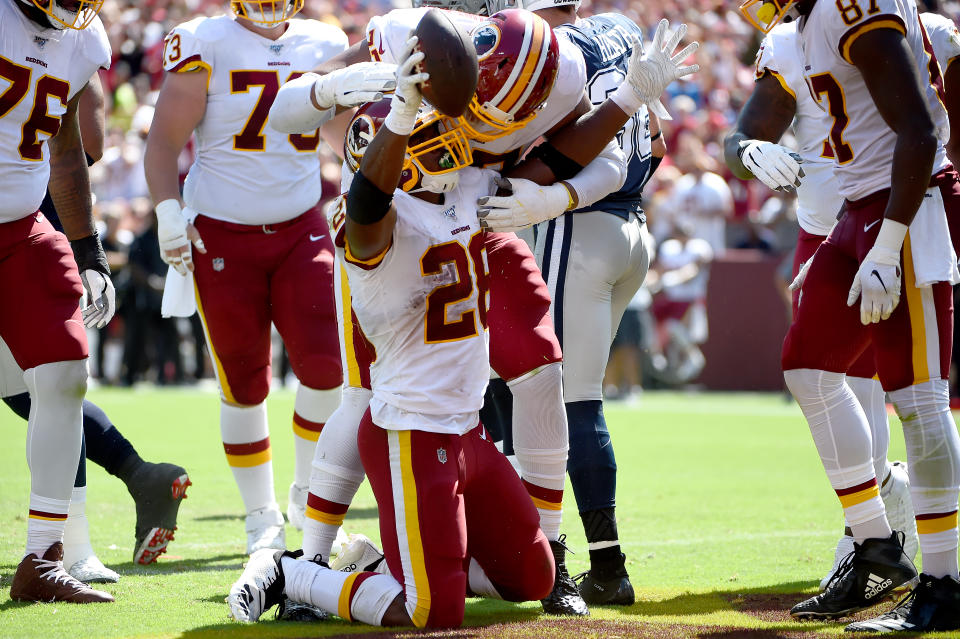 Adrian Peterson of the Washington Redskins celebrates with teammates after scoring a touchdown against the Dallas Cowboys. (Getty Images)