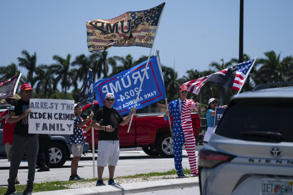 Supporters of former President Donald Trump gather outside Mar-A-Lago, Sunday, June 11, 2023, in Palm Beach, Fla. (AP Photo/Evan Vucci)