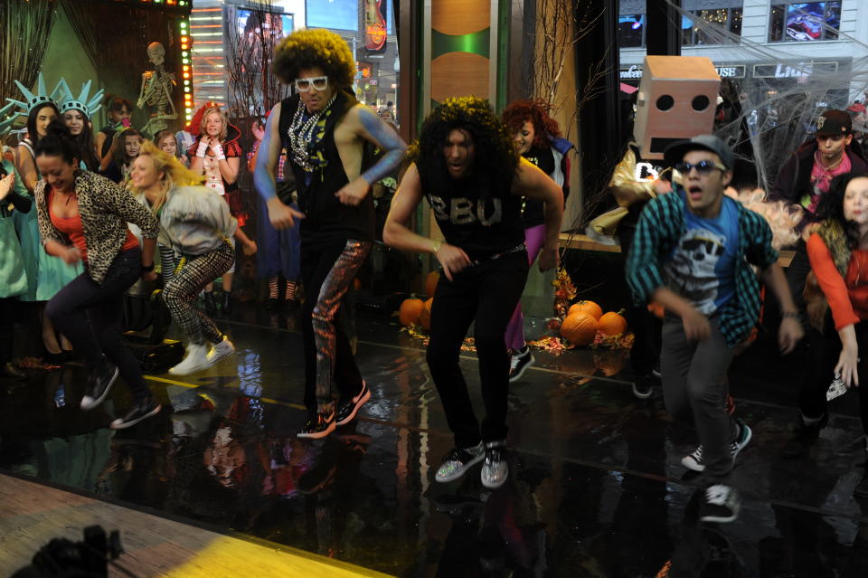 Josh Elliott and Sam Champion led the crew in a shuffle to LMAFO's hit, “Party Rock Anthem.”