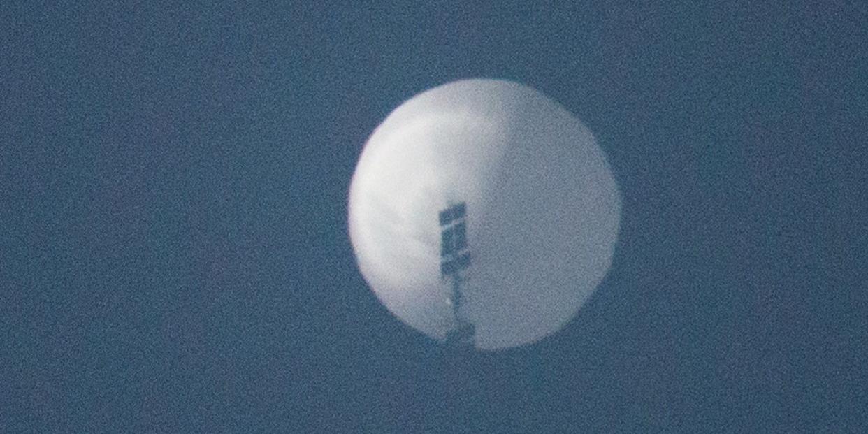 A balloon flies in the sky over Billings, Montana, on February 1, 2022.