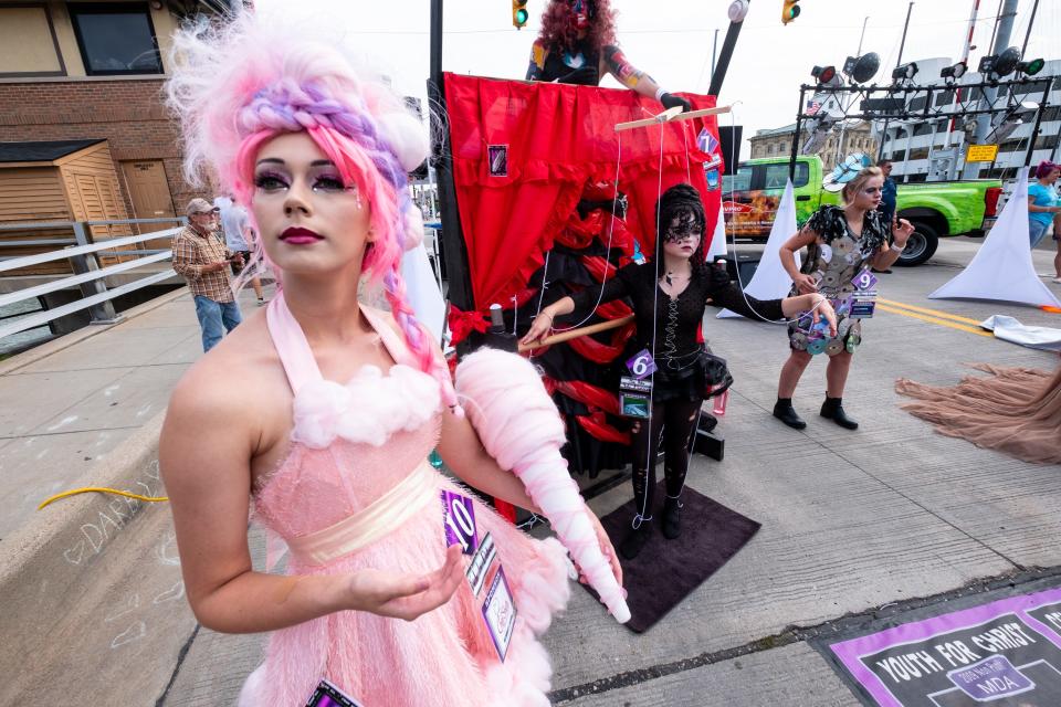 Living mannequins are on display during Mannequins Making a Difference on Boat Night Friday, July 23, 2021, in Port Huron.