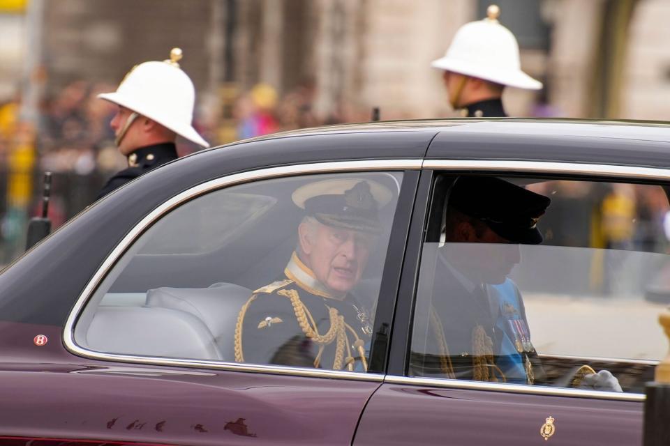 LONDON, ENGLAND - SEPTEMBER 19: King Charles III and Prince William, Prince of Wales are seen in a car ahead of the State Funeral of Queen Elizabeth II at Westminster Abbey on September 19, 2022 in London, England. Elizabeth Alexandra Mary Windsor was born in Bruton Street, Mayfair, London on 21 April 1926. She married Prince Philip in 1947 and ascended the throne of the United Kingdom and Commonwealth on 6 February 1952 after the death of her Father, King George VI. Queen Elizabeth II died at Balmoral Castle in Scotland on September 8, 2022, and is succeeded by her eldest son, King Charles III. (Photo by Emilio Morenatti - WPA Pool/Getty Images)