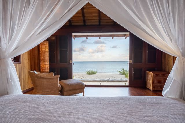 <p>Andre L. Phillip/Courtesy of Barbuda Belle Luxury Beach Hotel</p> The Frigate Bird bungalow at Barbuda Belle.