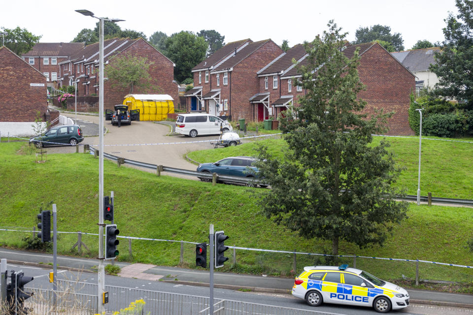 PLYMOUTH, UNITED KINGDOM - AUGUST 13: A police car sits at the the scene on Biddick Drive following a shooting in Keyham yesterday evening on August 13, 2021 in Plymouth, England. Police were called to a serious firearms incident in the Keyham area of Plymouth on Thursday evening where lone gunman, named by police as Jake Davison, 23, shot and killed five people before turning the gun on himself. (Photo by William Dax/Getty Images)