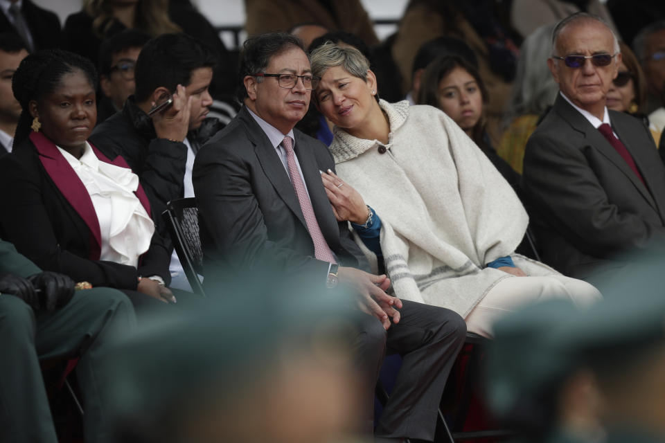 Colombian President Gustavo Petro, left, and his wife Veronica Alcocer attend a ceremony commemorating the battle of Boyaca that sealed Colombia's independence from Spain, in Puente de Boyaca, Colombia, Monday, Aug. 7, 2023. Petro is marking his first year in office, days after his son was charged for alleged illicit enrichment and money laundering in connection with his 2022 campaign funding. (AP Photo/Ivan Valencia)