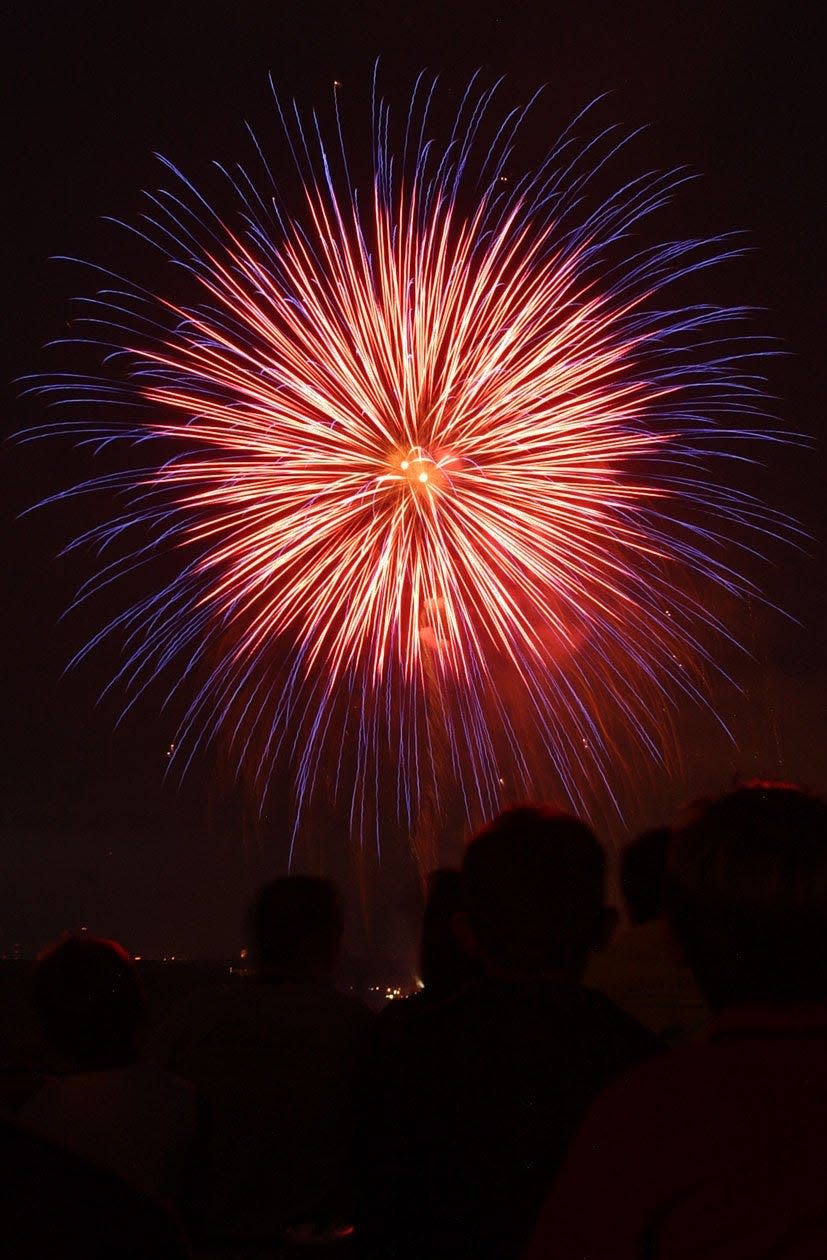 Fireworks fill the night sky. A Hudson fireworks maker once dreamed of sending a rocket to the moon.