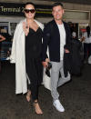 <p>Mom-to-be Adriana Lima and boyfriend Andre Lemmers arrive at the Nice Airport in France on May 16 ahead of this week's Cannes Film Festival. </p>