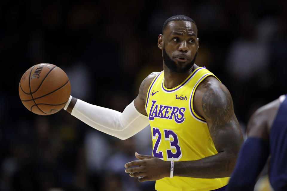 LeBron James showed off his court vision in his Lakers debut. (AP Photo/Gregory Bull)