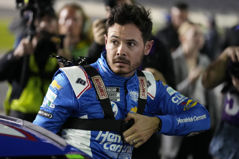 Kyle Larson climbs out of his car after finishing second during qualifying for the NASCAR Daytona 500 auto race Wednesday, Feb. 15, 2023, at Daytona International Speedway in Daytona Beach, Fla. (AP Photo/Chris O'Meara)