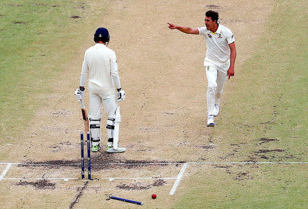 Cricket - Australia v England - Ashes test match - WACA Ground, Perth, Australia, December 17, 2017 - Australia's Mitchell Starc celebrates after bowling England's James Vince during the fourth day of the third Ashes cricket test match. REUTERS/David Gray