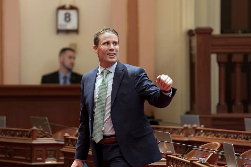 State Senate President Pro Tempore Designate Mike McGuire, of Healdsburg, greets other members lawmakers as he walks through the Senate Chambers at the Capitol in Sacramento, Calif., Monday, Jan. 8, 2024. McGuire will replace current Senate Pro Tempore Toni Atkins when he is sworn-in Monday Feb. 5, 2024. (AP Photo/Rich Pedroncelli)