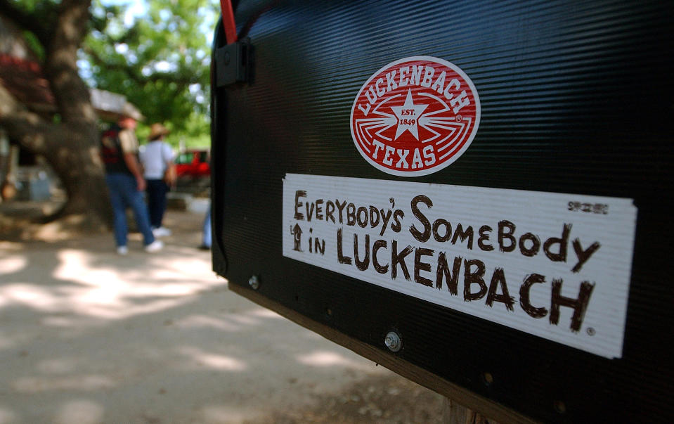 FILE - This May 8, 2004 file photo shows a mail box outside in Luckenbach, Texas, an unincorporated outpost in Texas hill country, seeped in country music history. Willie Nelson and Waylon Jennings sang about yearning to go back to this place, a metaphor for small towns and simple times where “everybody’s somebody.” (AP Photo/Tom Reel/San Antonio Express-News via AP)