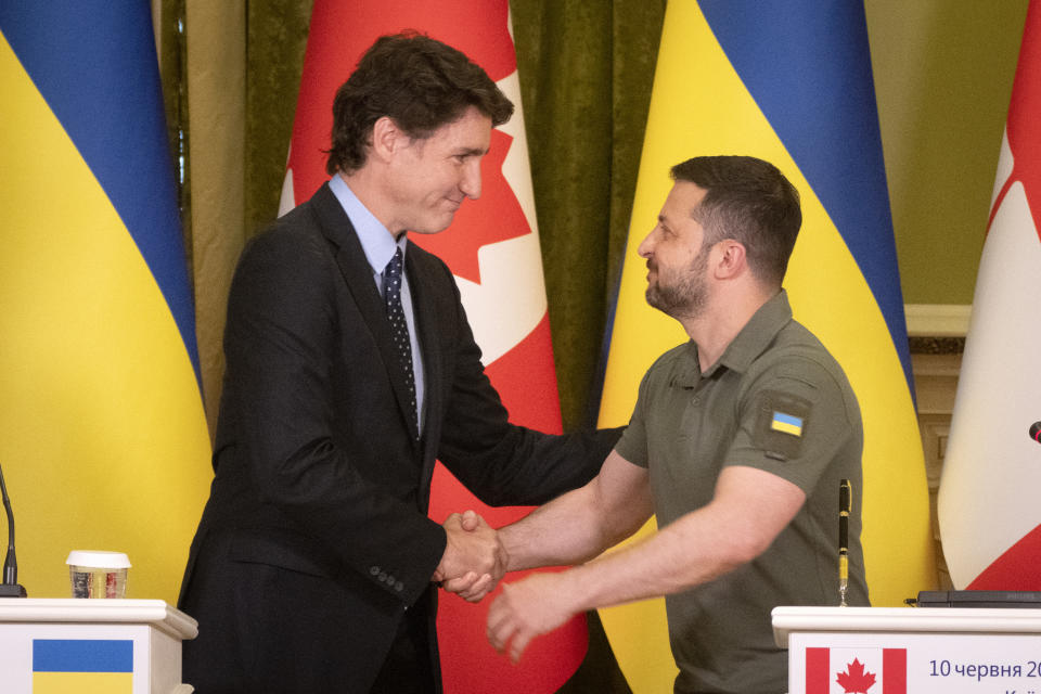 FILE- Canadian Prime Minister Justin Trudeau, left, meets with Ukrainian President Volodymyr Zelenskyy in Kyiv, Ukraine, June 10, 2023. Indian Prime Minister Narendra Modi has pledged not let the weekend summit of Group of 20 become overshadowed by Ukraine and has made a point of not inviting Ukraine to participate in this year's event. Trudeau has promised Zelenskyy to keep Ukraine in the discussions, telling him in a video call that Zelenskyy posted on Instagram, that “I'm disappointed that you won't be included but as you know, we will be speaking up strongly for you.” (AP Photo/Efrem Lukatsky, File)