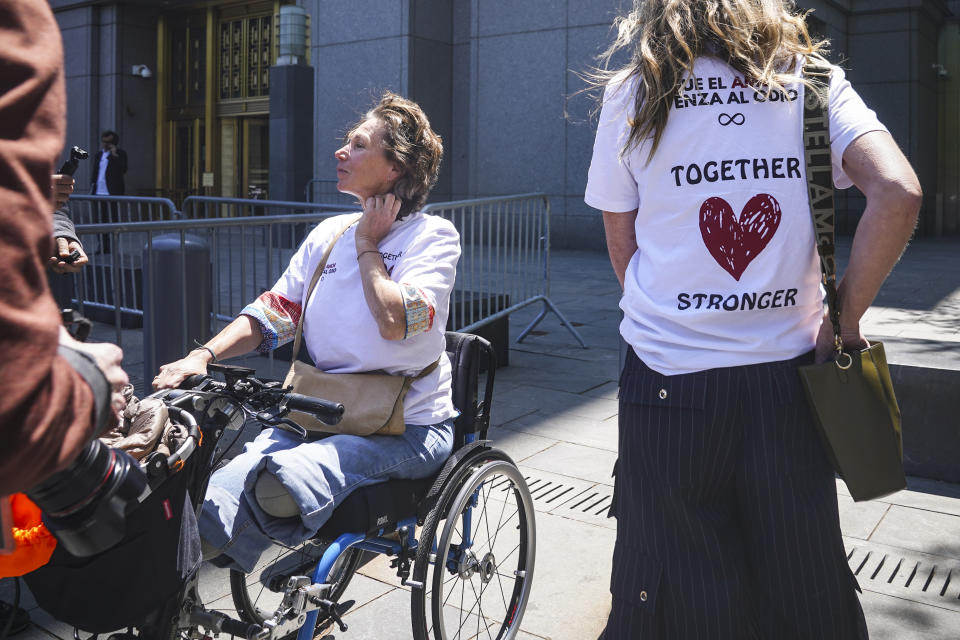 Marion Van Reeth, left, leaves Manhattan federal court after making a victim statement at the sentencing hearing of convicted Islamic extremist Sayfullo Saipov, Wednesday May 17, 2023, in New York. Saipov carried out an attack on Halloween in 2017 when he ran his rented truck onto a bike path in lower Manhattan killing eight people and injuring others, including Reeth. (AP Photo/Bebeto Matthews)