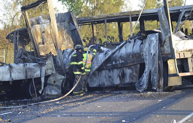 A FedEx truck driver in the US lost control of the vehicle before slamming into a tour bus carrying students. The accident claimed nine lives and injured 32. Those injured were taken to a nearby hospital. (AP Photo)