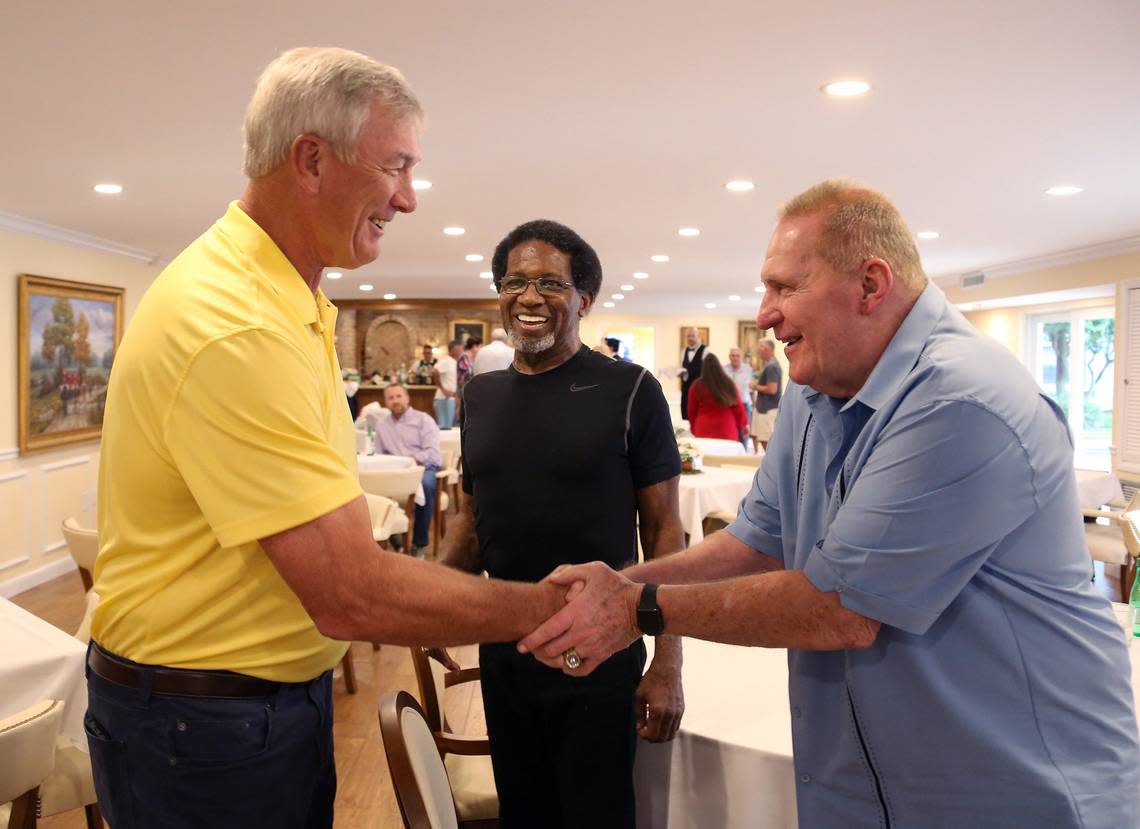 “Perfect Season” Miami Dolphins of ’72 team Larry Ball, left, is greeted by Jim Kiick, right, as fellow teammate Eugene Edward “Mercury “ Morris looks on. Jim Kiick kicked off his 72th birthday with a birthday party with the attendance of Miami Dolphins NFL Hall of Famers along with many Dolphins greats inside the dining room of the Independence Hall Retirement in Walton Manors, Florida on Thursday, August 9, 2018.