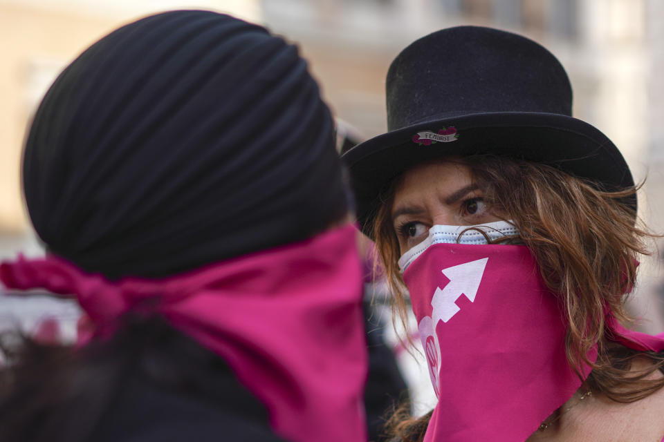 Women take part in a demonstration on the International Day for the Elimination of Violence against Women, in Rome, Wednesday, Nov. 25, 2020. (AP Photo/Andrew Medichini)