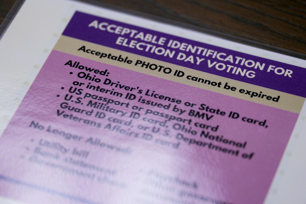 Signs at St. Bernard City Hall on Tuesday list the new requirements for voter identification.