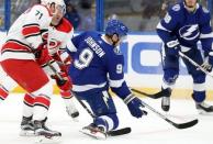 Oct 16, 2018; Tampa, FL, USA; Tampa Bay Lightning center Tyler Johnson (9) defends the puck during the first period at Amalie Arena. Mandatory Credit: Kim Klement-USA TODAY Sports