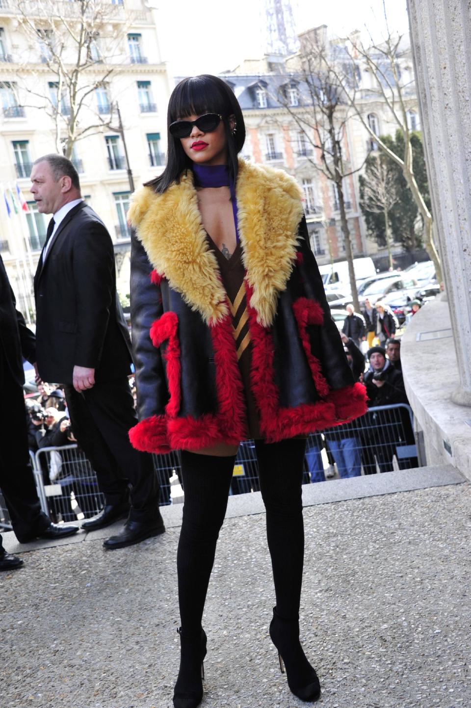 Singer Rihanna poses as she arrives at Miu Miu's ready to wear fall/winter 2014-2015 fashion collection in Paris, Wednesday, March 5, 2014. (AP Photo/Zacharie Scheurer)