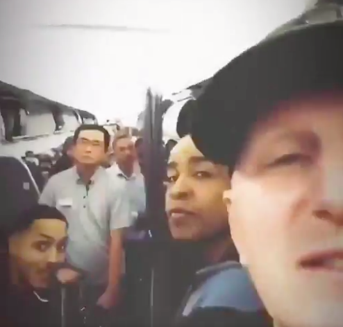 Michael, pictured here with friends and other passengers, took to Twitter to talk about the incident. Source: Twitter/MichaelRapaport