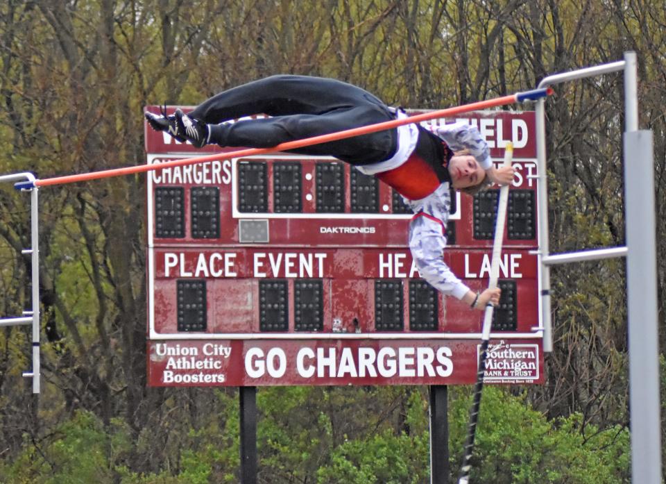 Quincy's Corey Turner brought home gold with a victory in the pole vault Friday at the UC Invite