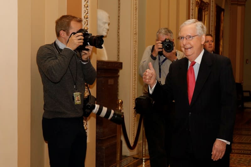 U.S. Senate Majority Leader McConnell enters the Senate Chamber Floor after Congress agreed to a multi-trillion dollar economic stimulus package created in response to the economic fallout from the COVID-19 Coronavirus, on Capitol Hill in Washington