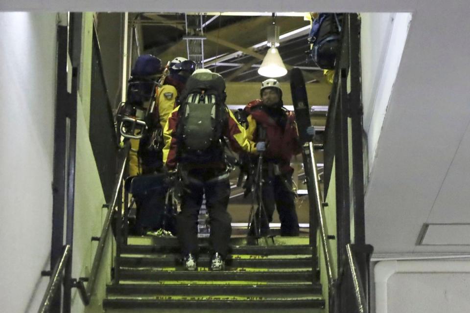 Police officers prepare to head to the site of an avalanche, at a ski resort in the village of Otari, Nagano prefecture, Japan Sunday, Jan. 29, 2023 (AP)