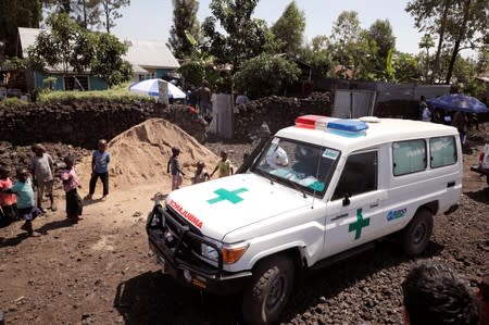 An ambulance waits next to a health clinic to transport a suspected Ebola patient in Goma