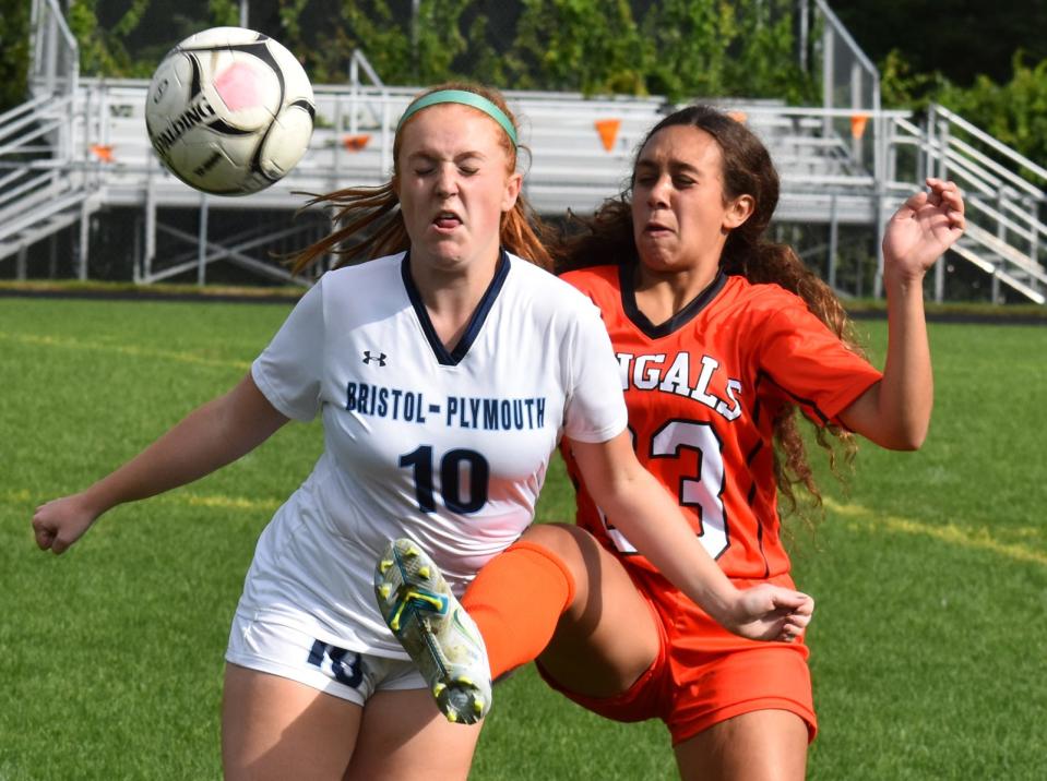 Diman's Ella Botelho, right, battles for the loose ball with Bristol-Plymouth defender.