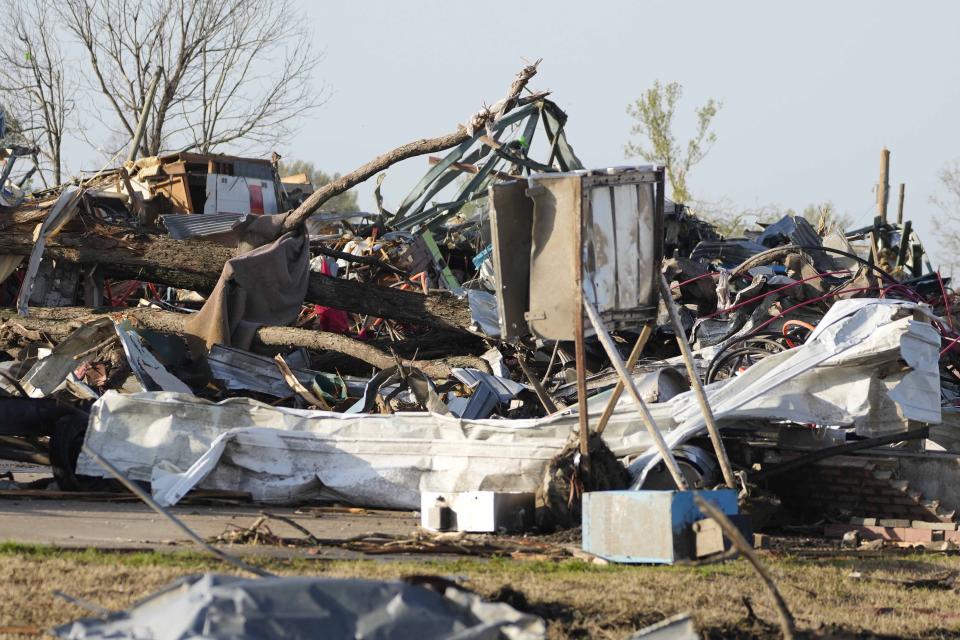 Piles of debris, insulation, damaged vehicles and home furnishings are all that remain this neighborhood in Rolling Fork, Miss., Saturday morning, March 25, 2023. Emergency officials in Mississippi say several people have been killed by tornadoes that tore through the state on Friday night, destroying buildings and knocking out power as severe weather produced hail the size of golf balls moved through several southern states. (AP Photo/Rogelio V. Solis)